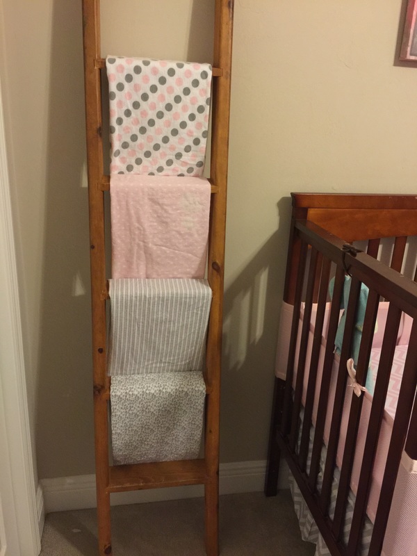 Upcycle ladder from bunkbed to baby blanket holder. MotherDaughterProjects.com