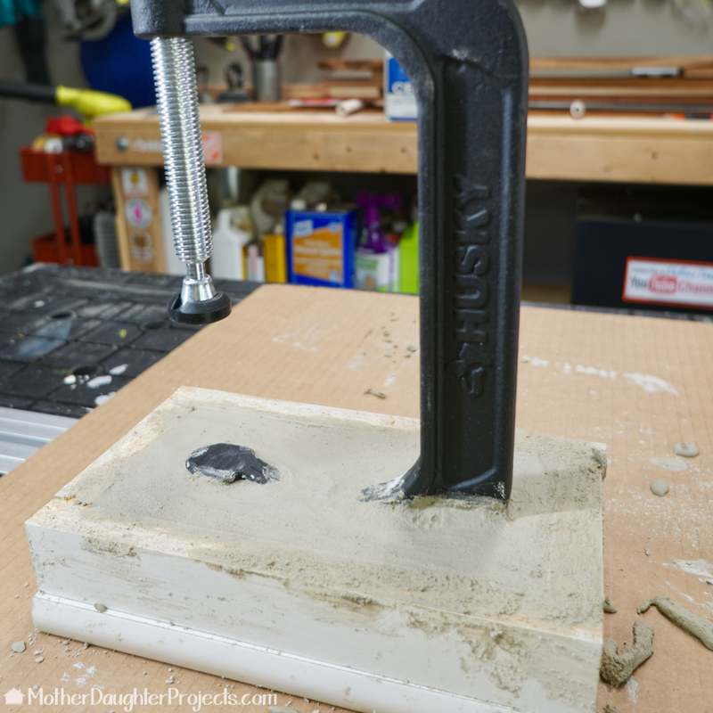 Learn how to use a new or vintage clamp to make a rustic industrial concrete book holder. This book stand would also be great in a workshop to hold tool instructions.
