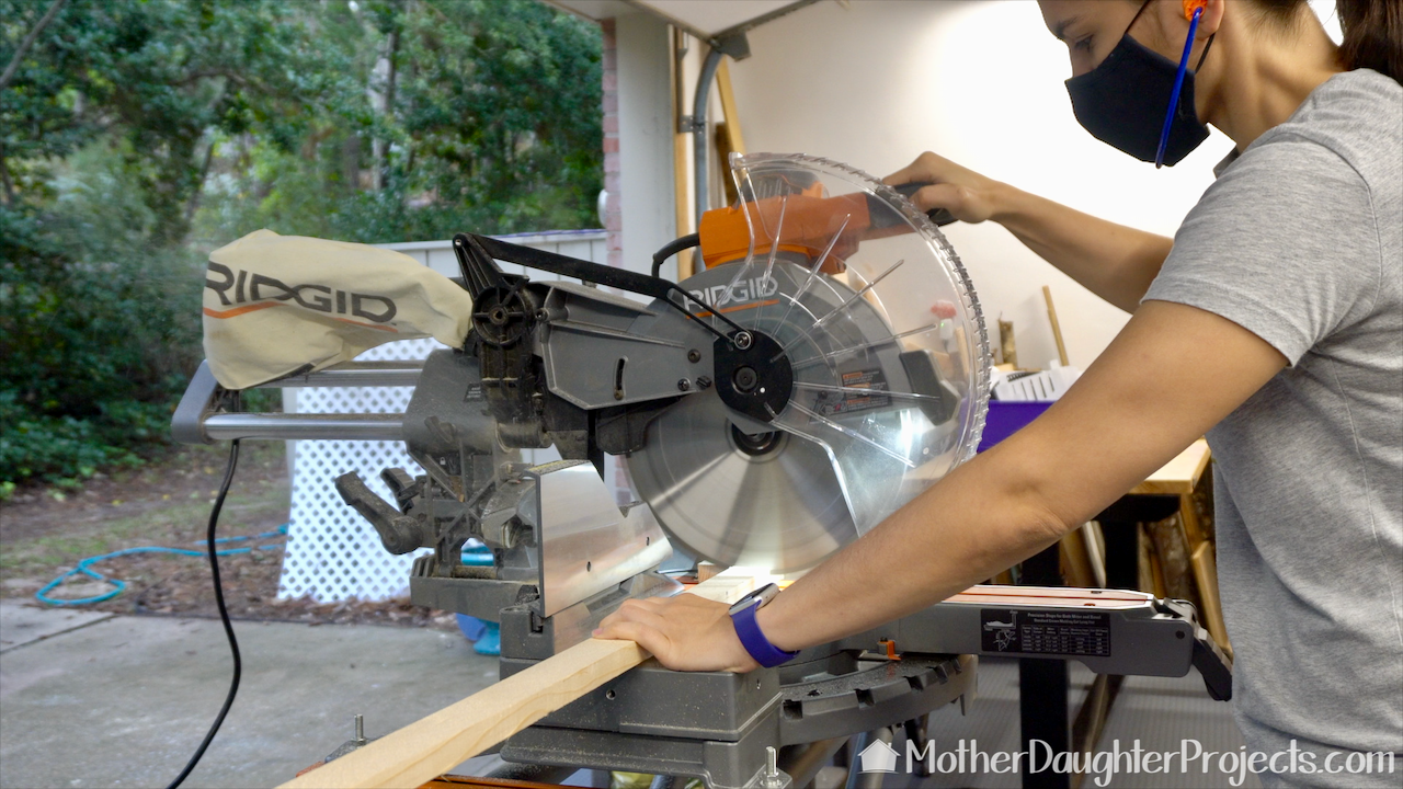 Using the Ridgid miter saw to cut the legs to length. 