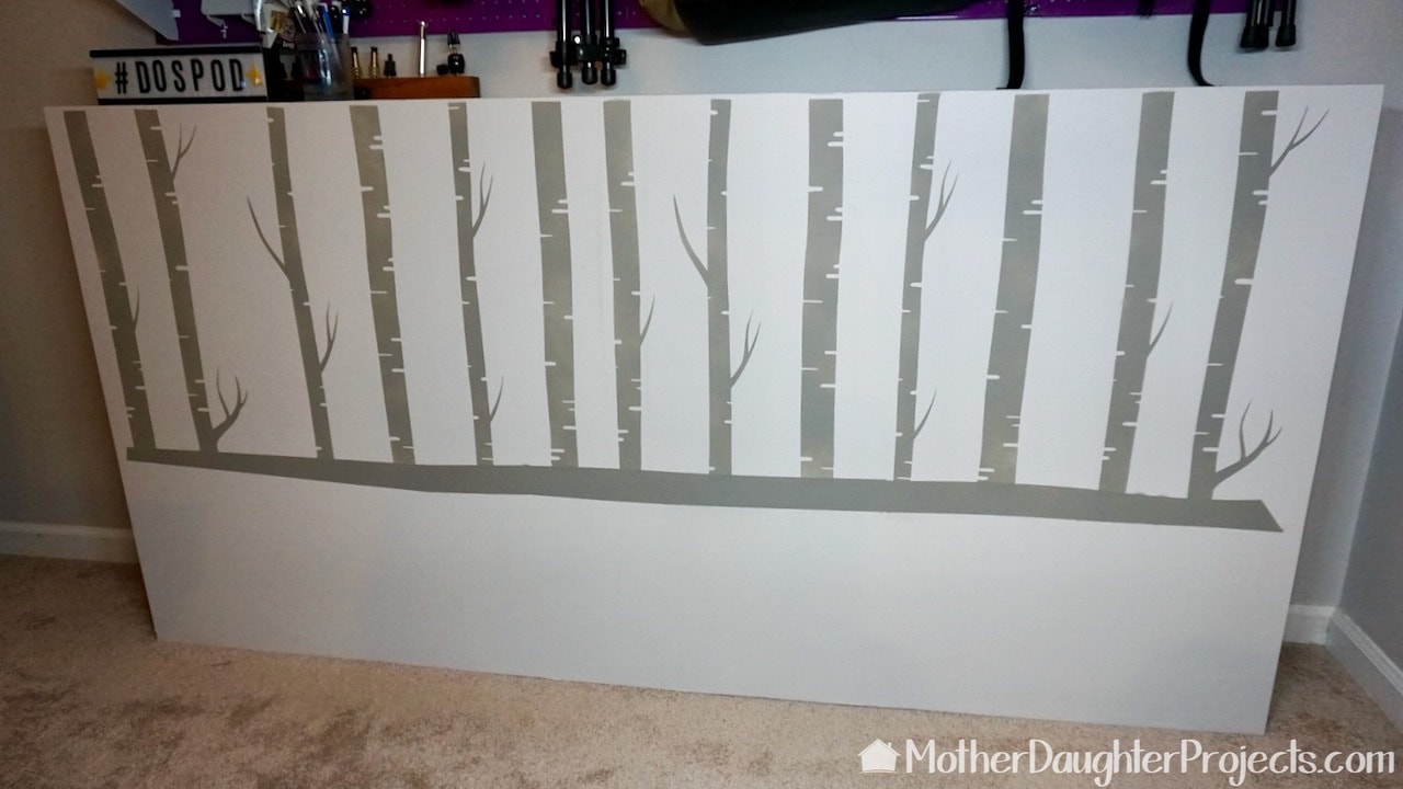 The after of the nature inspired chalk painted stenciled birch trees.