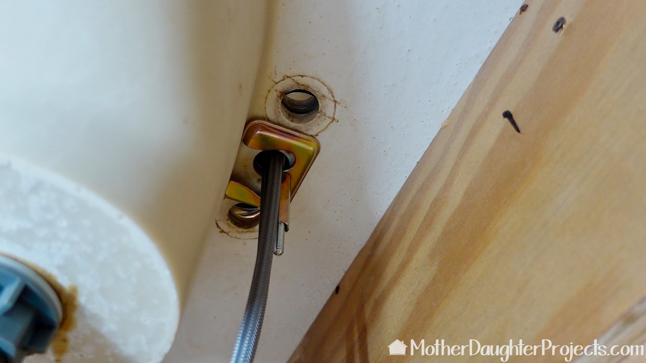 Installing the Kohler tome single handle faucet.