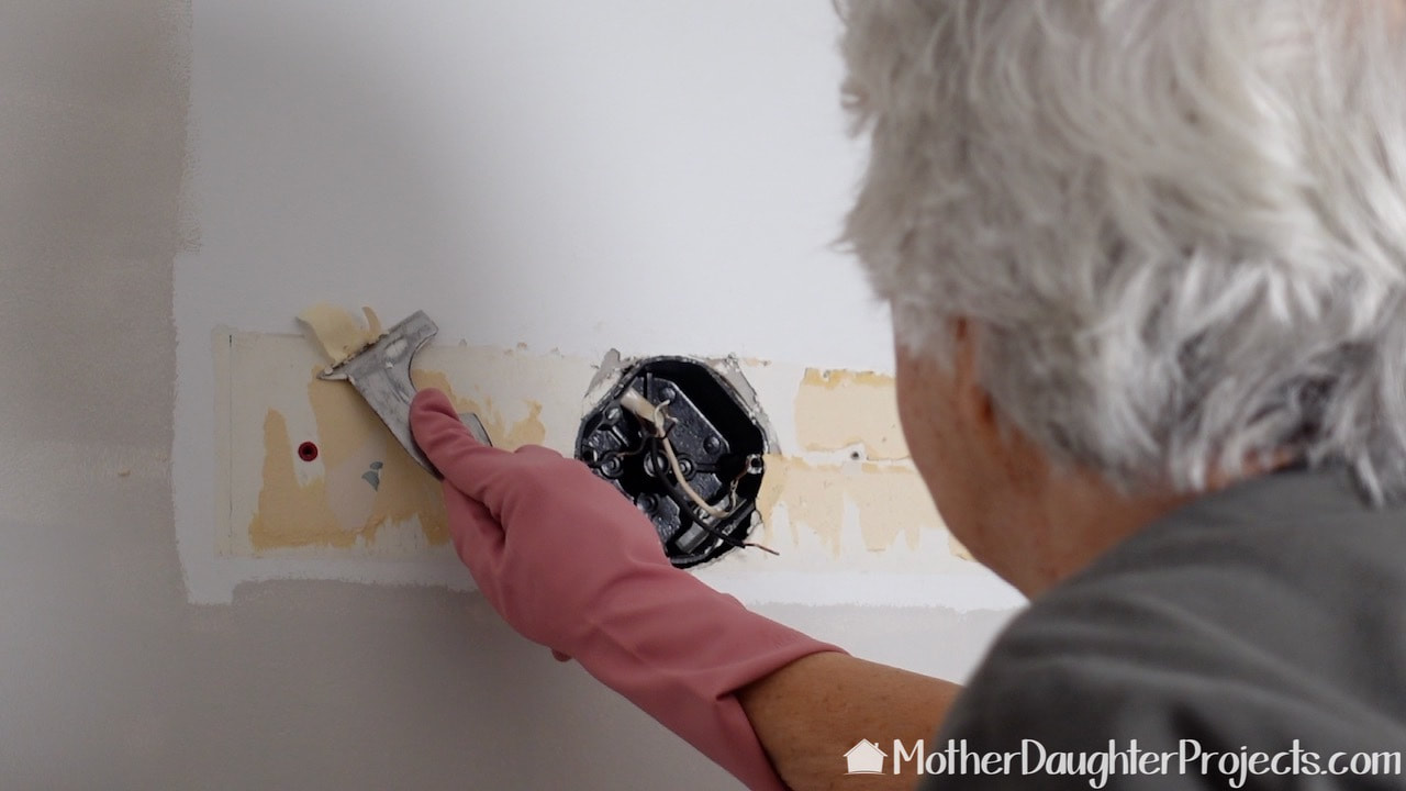 how to remove wallpaper with water and a scraper. 