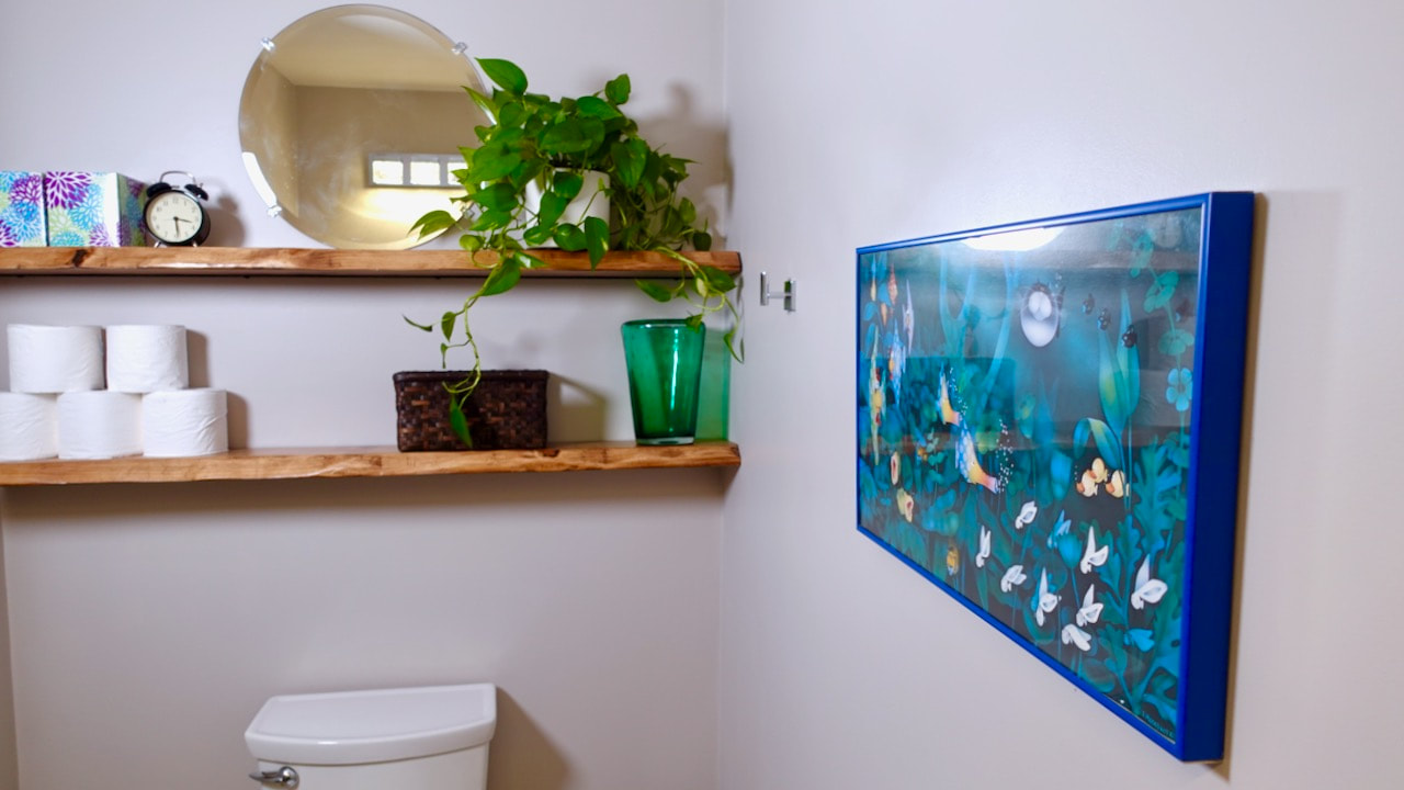 We made fake or faux live edge floating shelves in this small budge bathroom makeover. 
