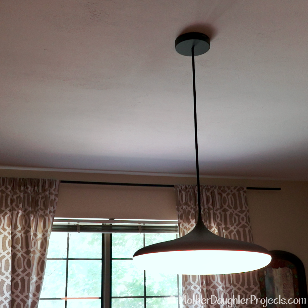 The Phillips Hue pendant can be programed to automatically off and on.