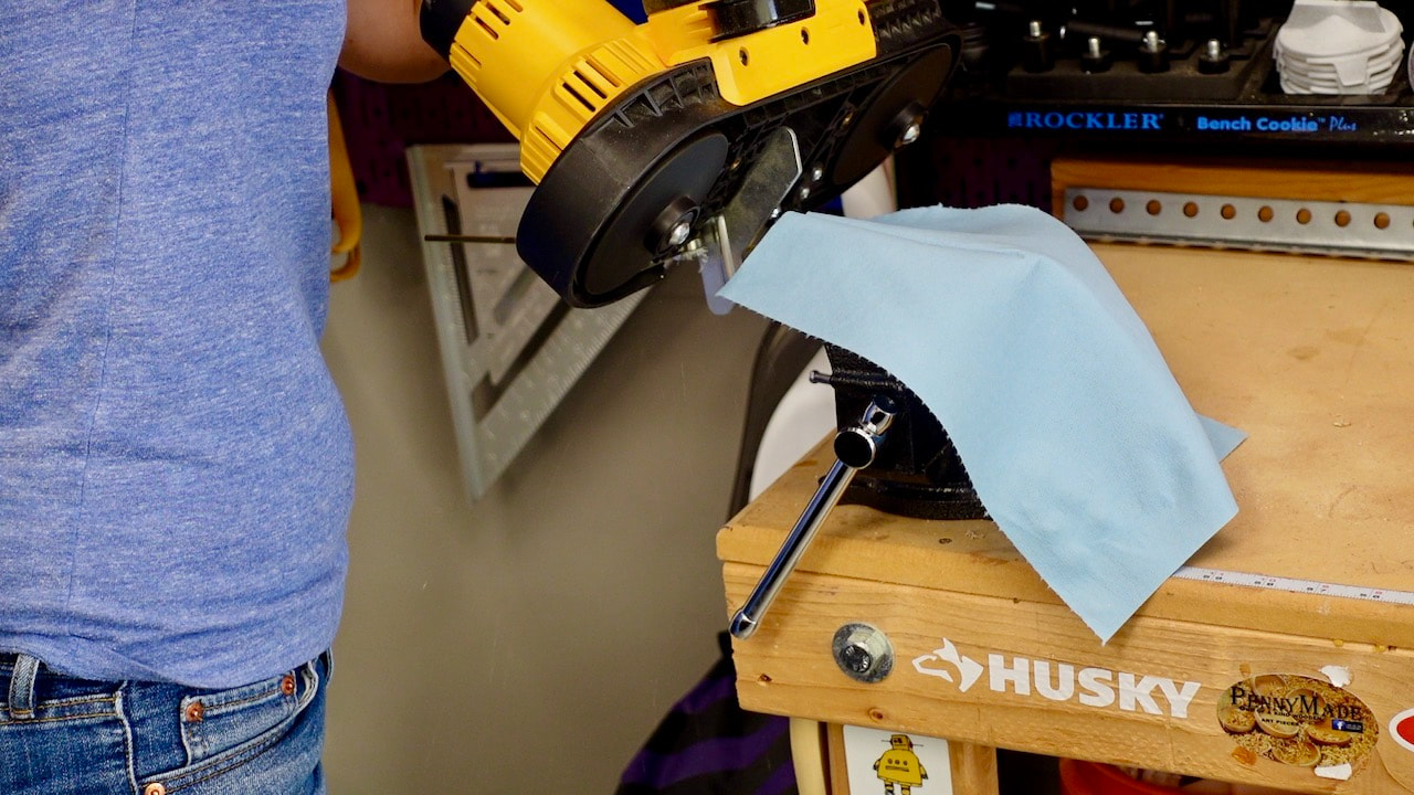 Cutting the brass with a DeWalt battery powered band saw.
