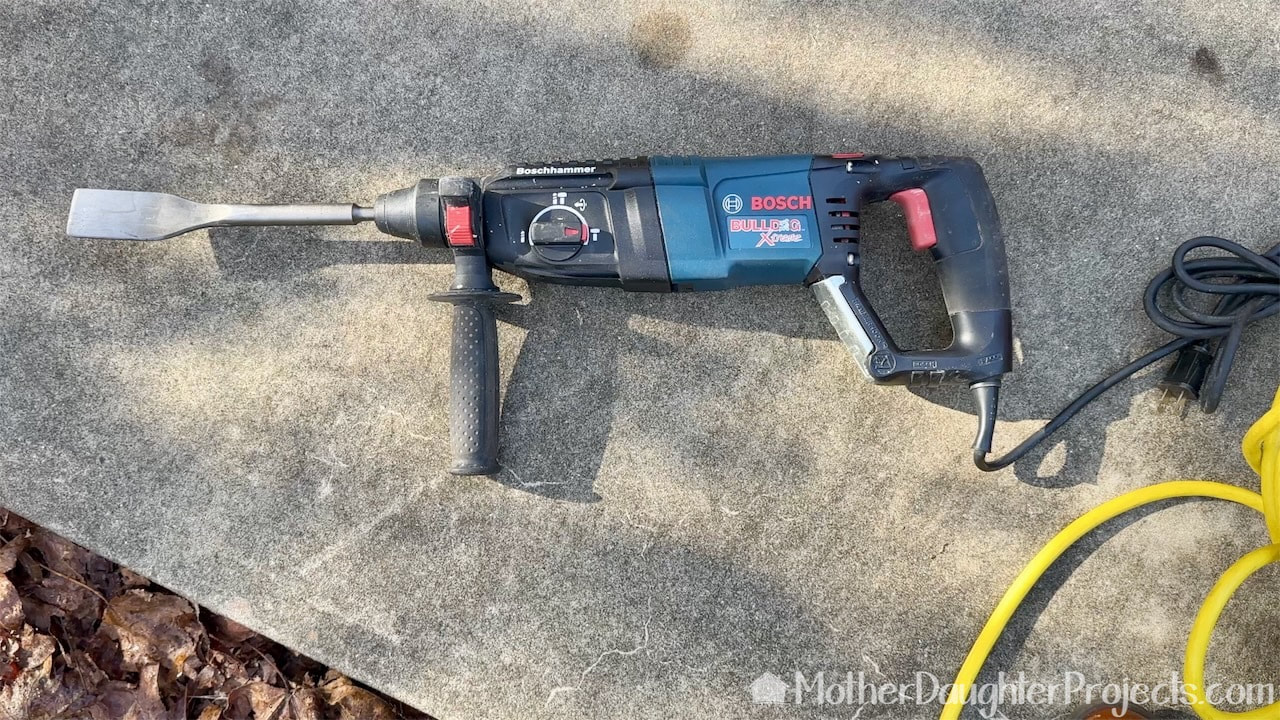 how too remove the old mortar from tiles with a Bosch rotary hammer drill.