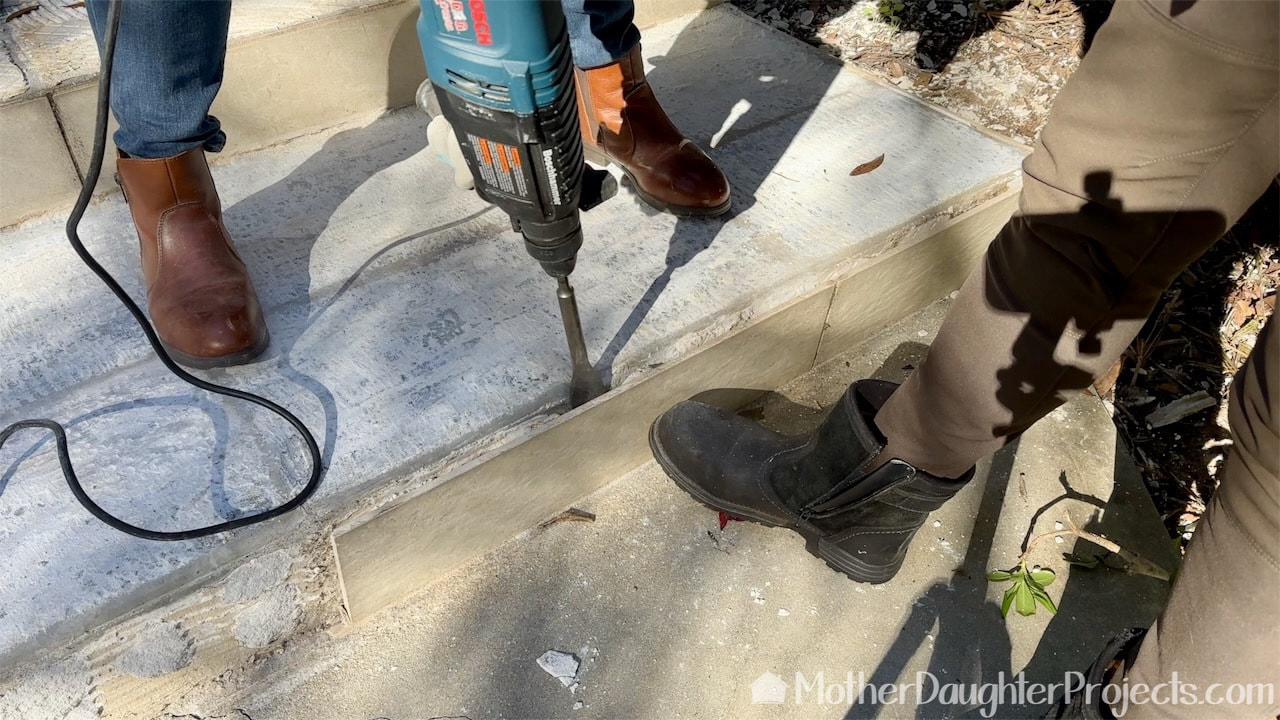Removing the old mortar with the Bosch rotary hammer drill.