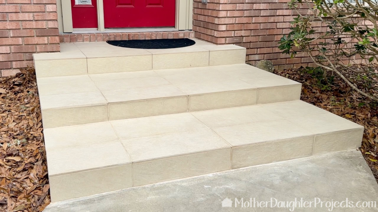 the retiled front steps look like they originally did so you can say we did okay with our first tiling project.