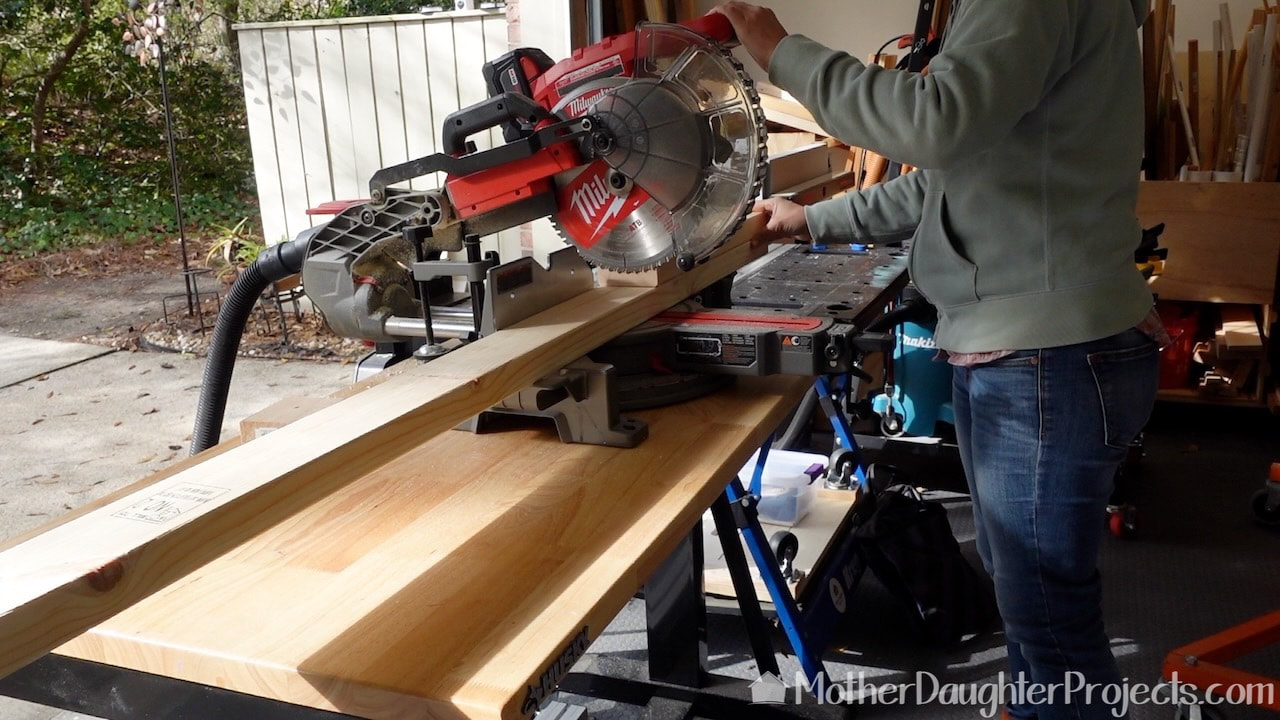 Cutting the 2x4s on the Milwaukee miter saw for the garage tote storage unit. 