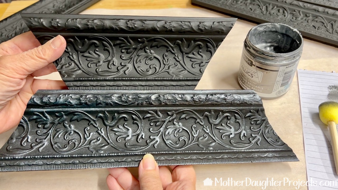 To emphasize the raised detail, I lightly painted them with DecoArt silver metallic paint.