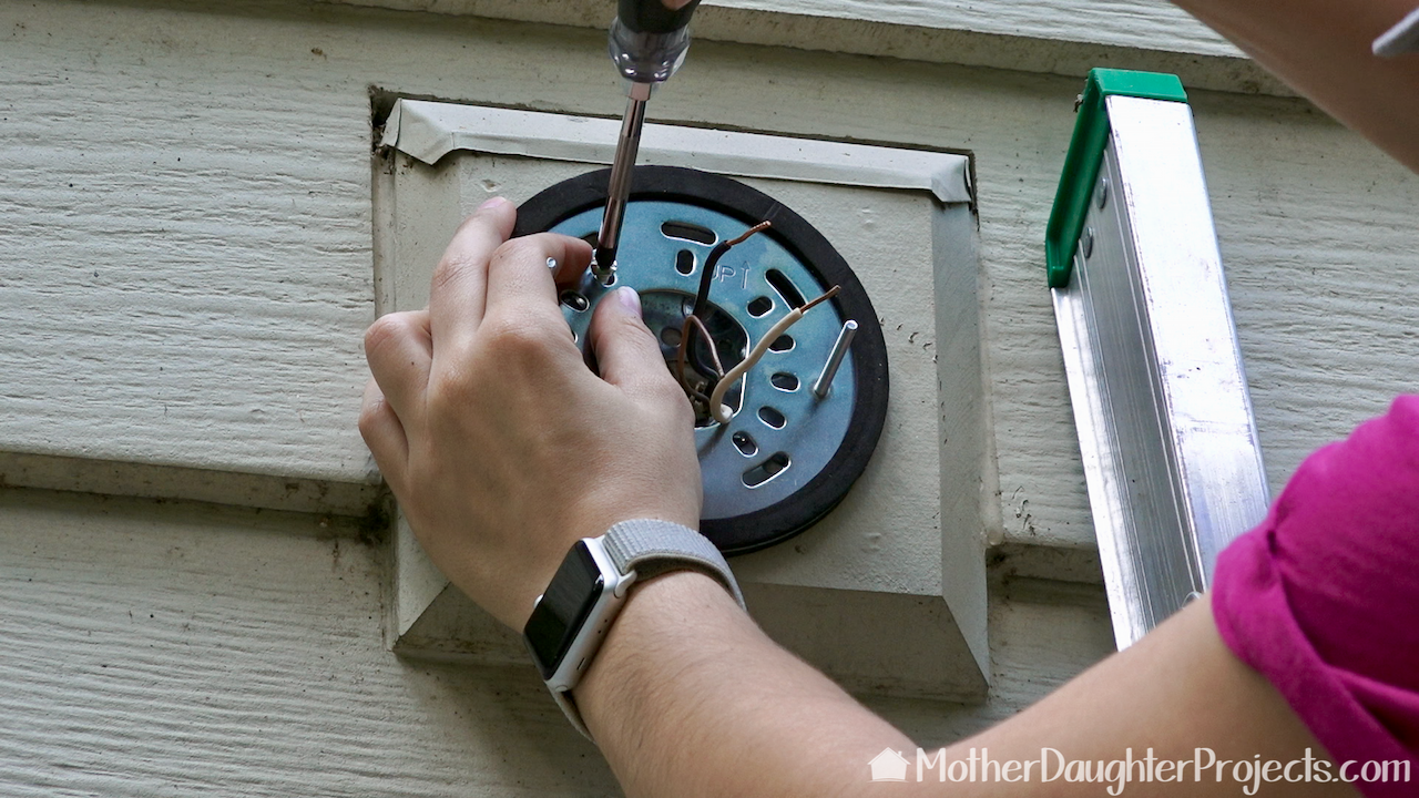 Attaching the Ring Outdoor Wi-Fi Cam with Motion Activated Floodlight base. 