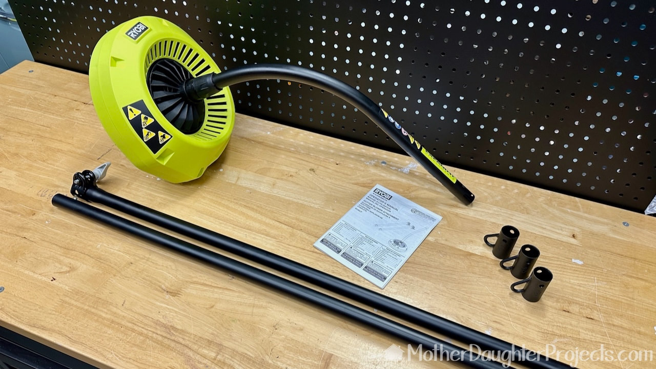 This attachment which fits on the Ryobi Expand-It system powerhead includes the blower, two extension poles and three caps to hang the parts.