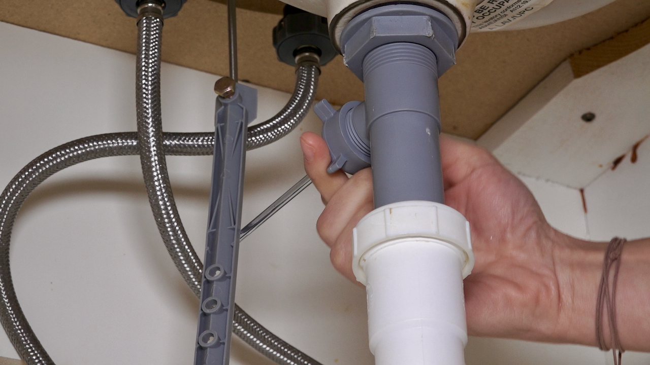 removing drain plug from bathroom sink
