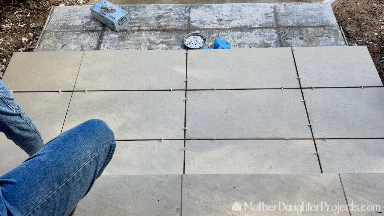 Using plastic spacers to set the tile.