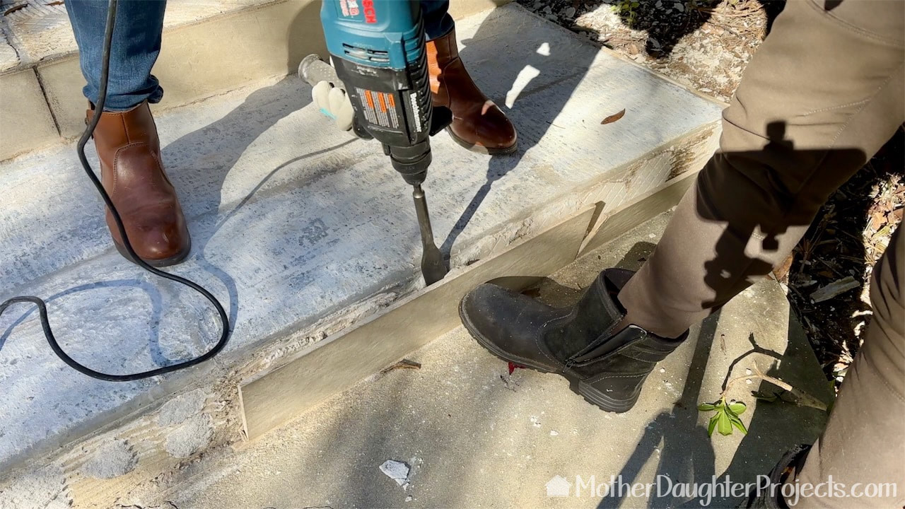 Removing tiles with a Bosch rotary hammer drill. 