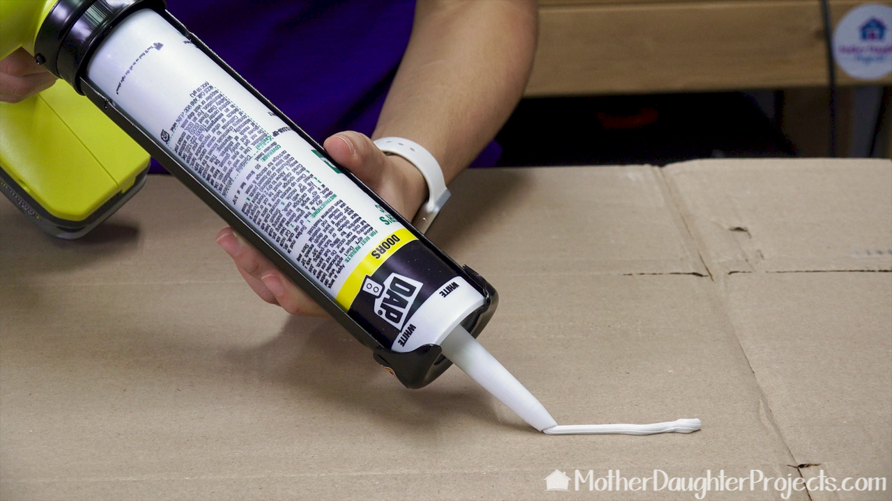 Learn how to use a battery power caulk and adhesive gun. See it in action to seal an outdoor concrete crack.