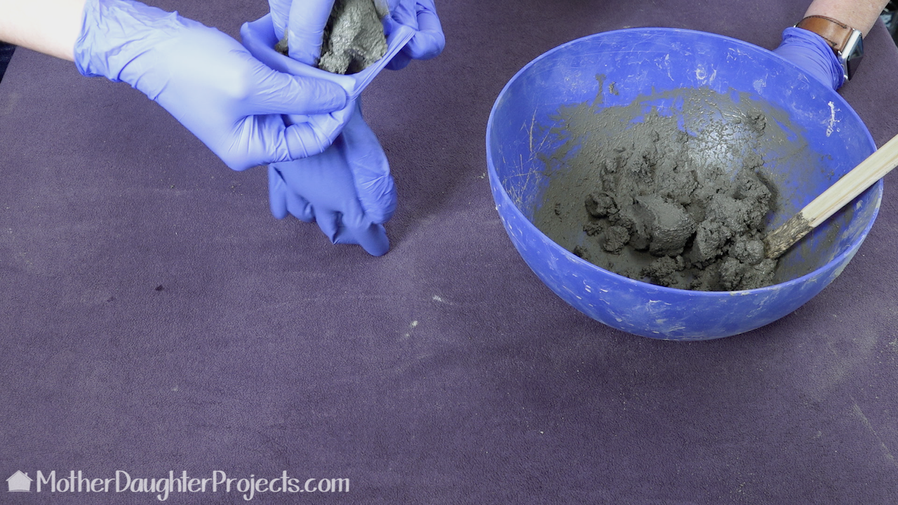 Fill the glove with the Quikrete mortar mix. 