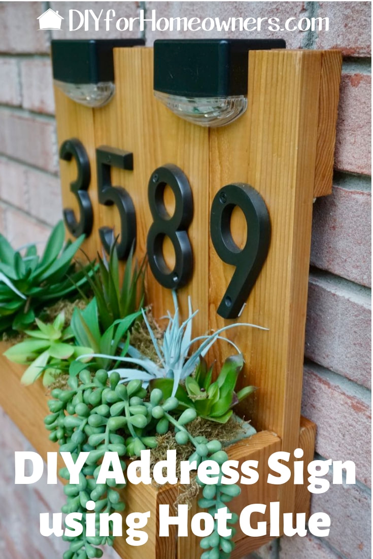 Improve your home's curb appeal with this DIY address sign. Fill the rustic planter with faux or real succulents or flowers. Dusk to dawn solar lights helps improve sign visibility at night. 
