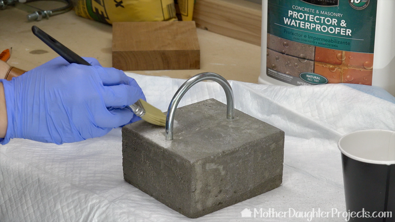 Learn how to use concrete, cement or mortar mix to make a modern door stop. Lego bricks make a perfect mold for this DIY,