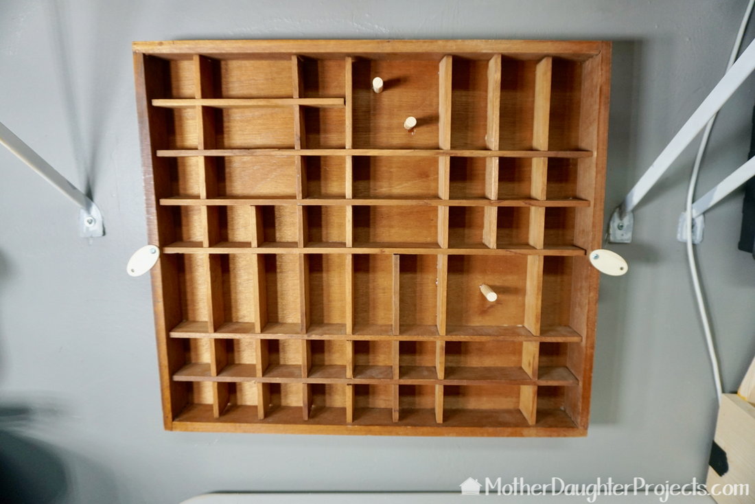 Learn how to take a vintage printer's tray and turn it into storage for small knick knacks, screws, or accessories. 