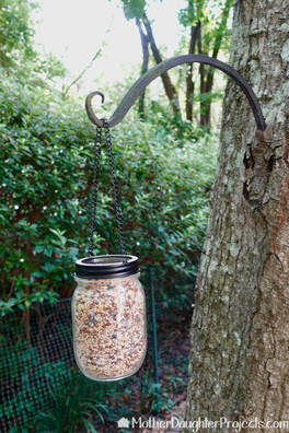 A covered area is best to keep rain out of the bird feeder. 