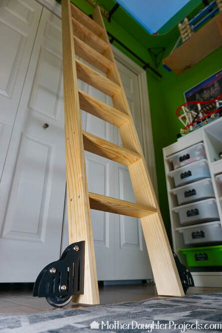 Picture shows the bottom of the ladder with the roller hardware in place.