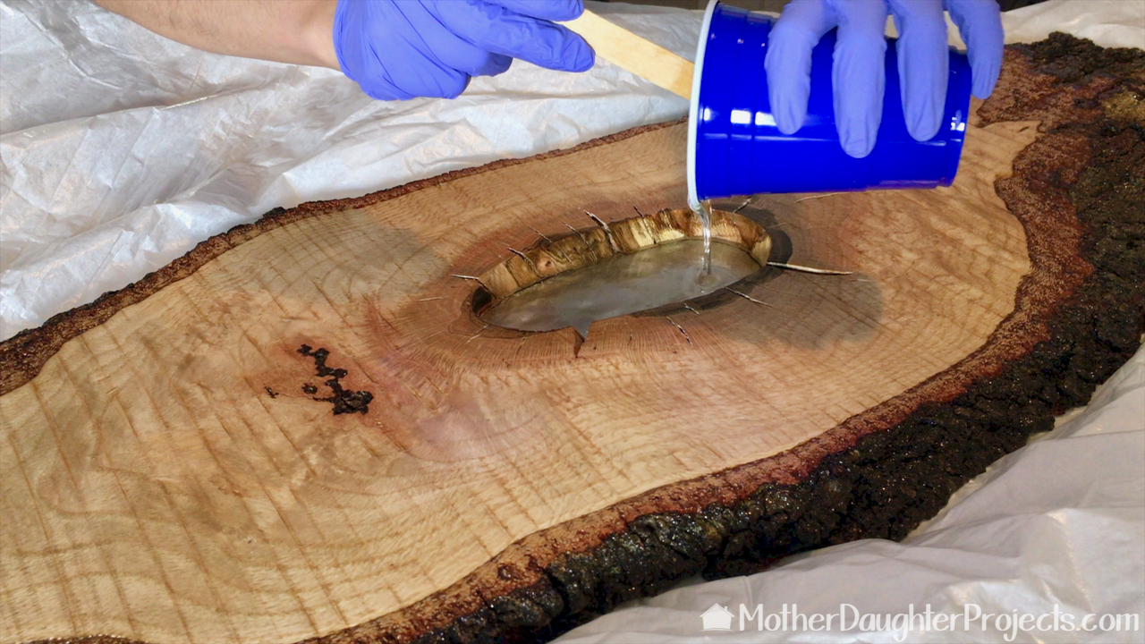 Learn how to make a hanging table out of live edge wood and epoxy.