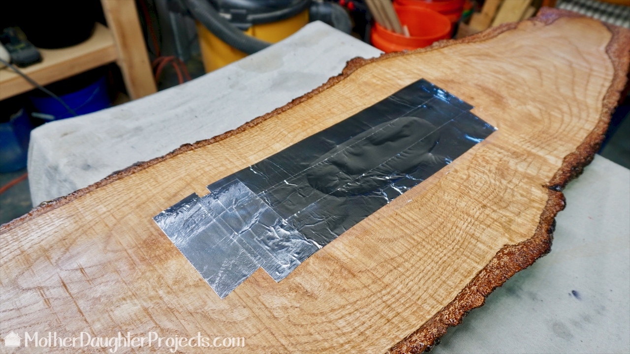 Learn how to make a hanging table out of live edge wood and epoxy.
