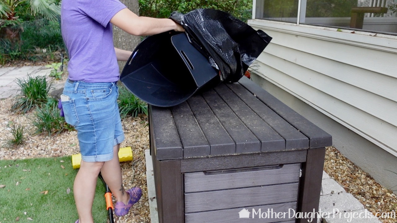 Showing how to insert the Bag Butler into the outdoor garbage bag. 