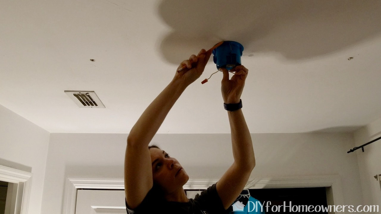 We used a battery powered Dremel to cut the hole in the ceiling.