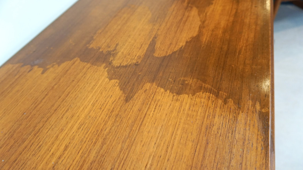 Cigarette smoke, tar and nicotine can produce a sticky residue on vintage mid century furniture.