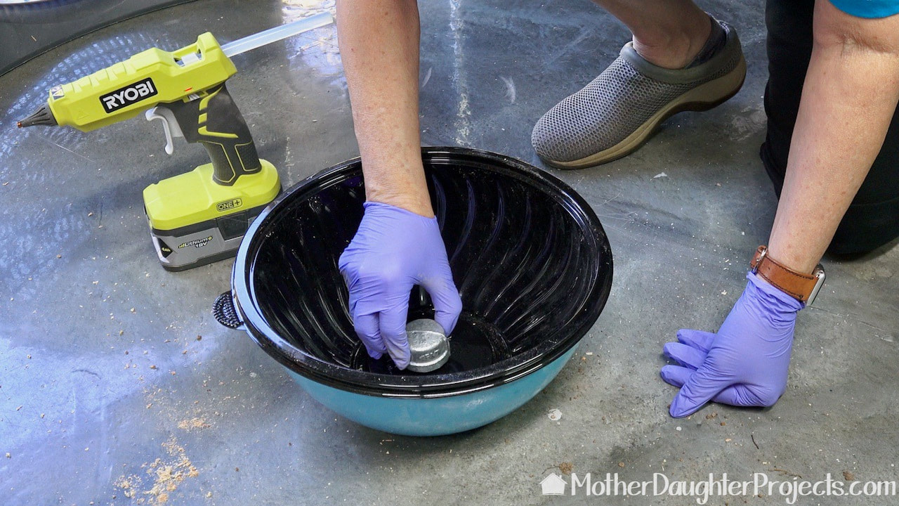 A plastic deli bowl set inside a more rigid bowl works as a concrete cement base mold.