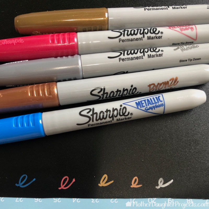 Here's a photo of various colors of Sharpie on the black Cricut chalkboard vinyl.