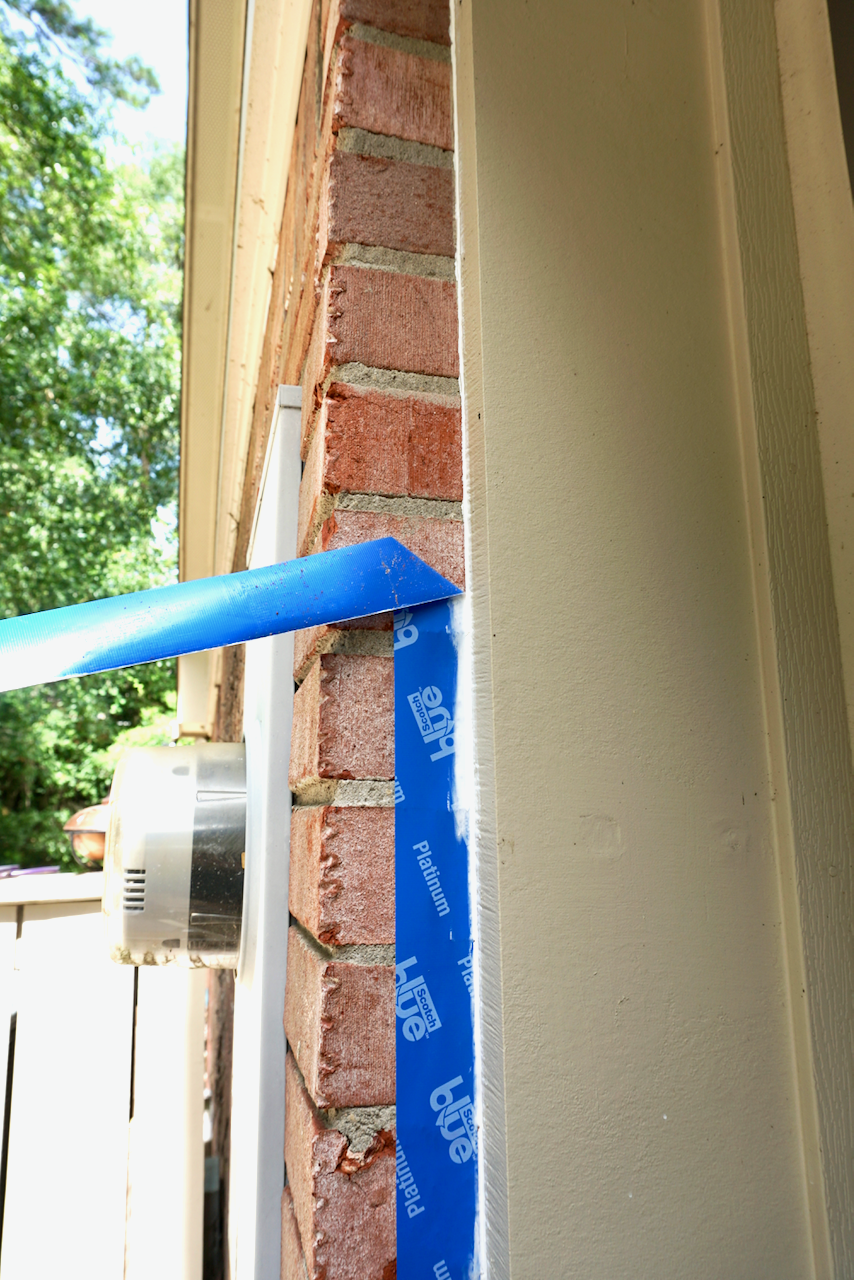Use painter's tape to get a nice crisp line of caulk on brick. 
