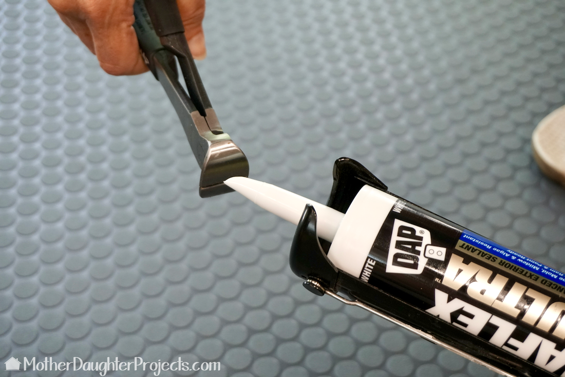 Use Husky End Nippers to cut the end of the caulk tube. 