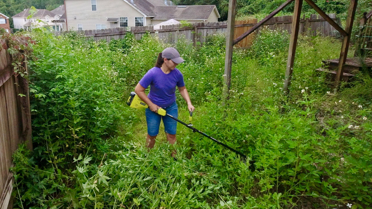 As Steph cut the weeds, they were carried out and put curbside for pickup. It took about 90 minutes to get all the weeds cut and out of the backyard. 