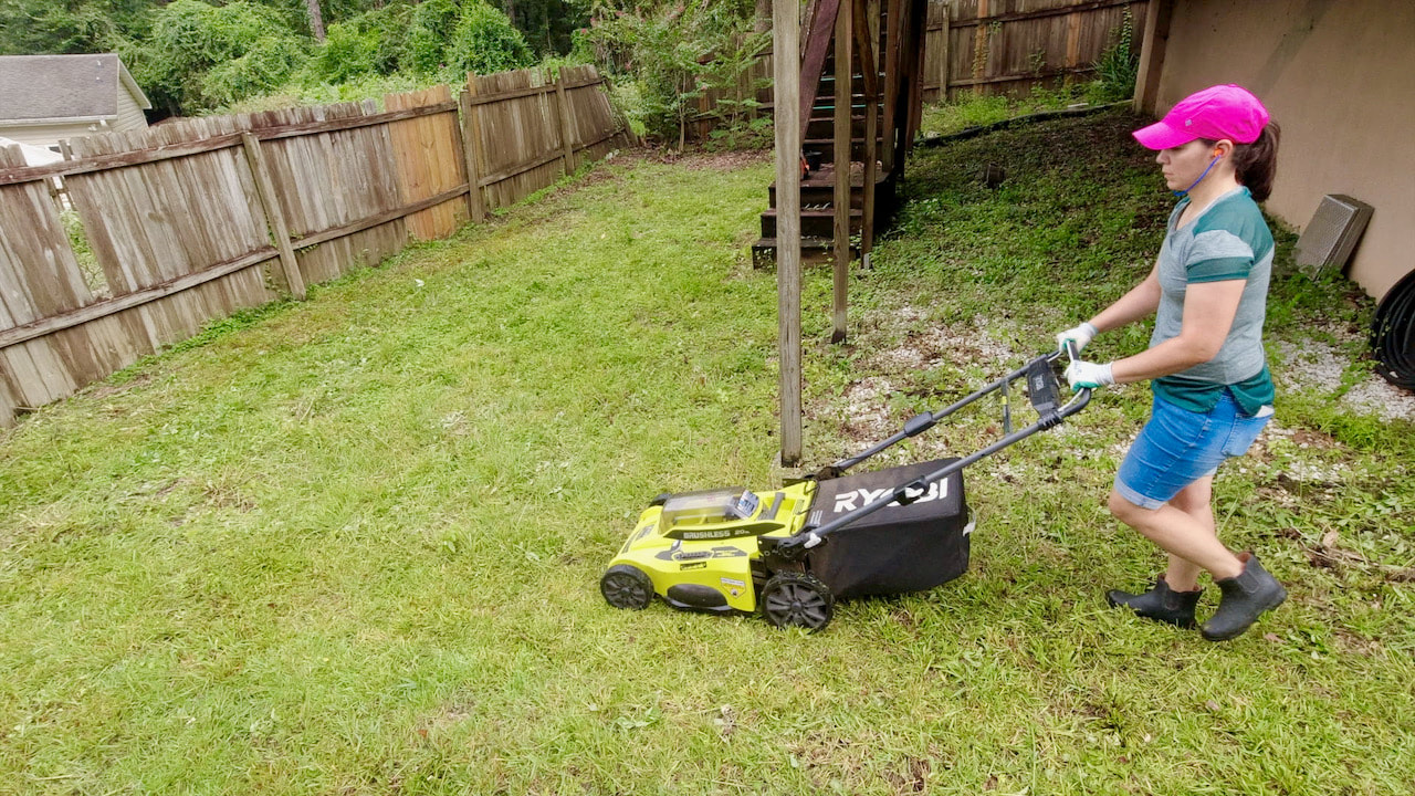 Once all the yard debris was removed, Steph mowed the grass with her Ryobi 40 volt lawn mower. This uses the same battery as the Expand-It system.