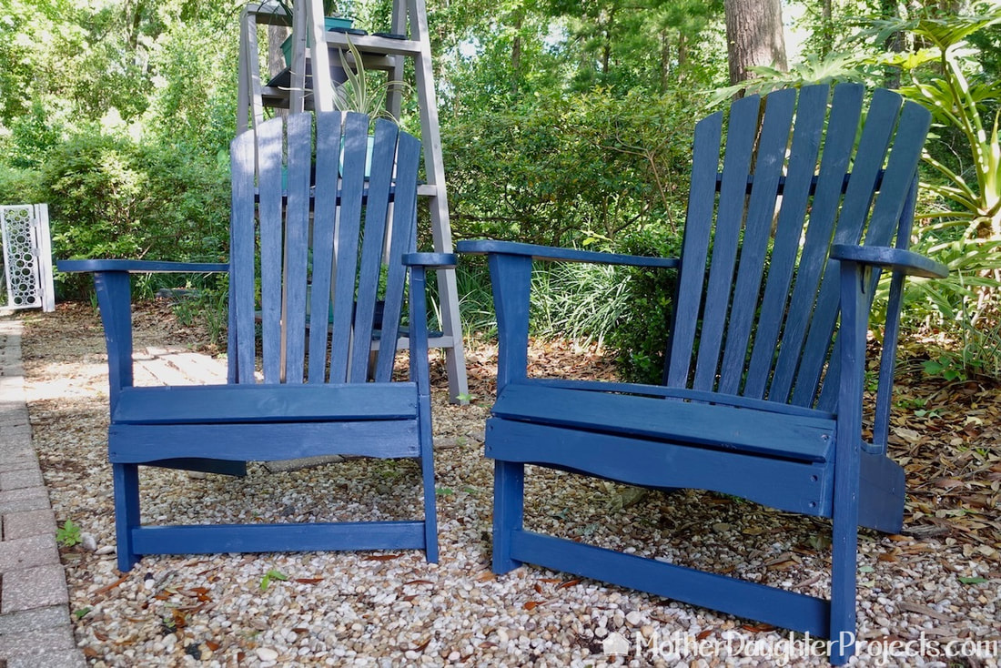 The finished Adirondack chairs finished and in place in the garden.