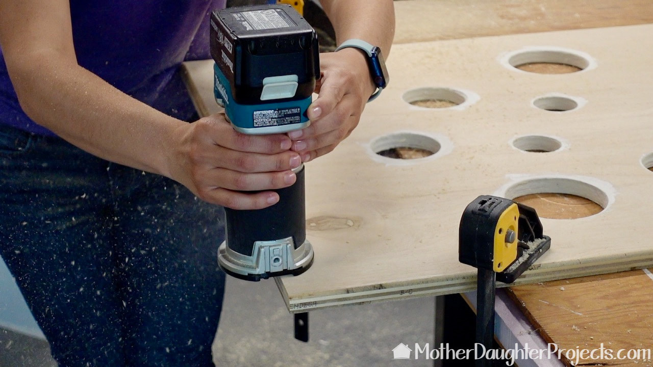 Here we are using a Makita palm router to give the toy storage a smooth safe edge. 