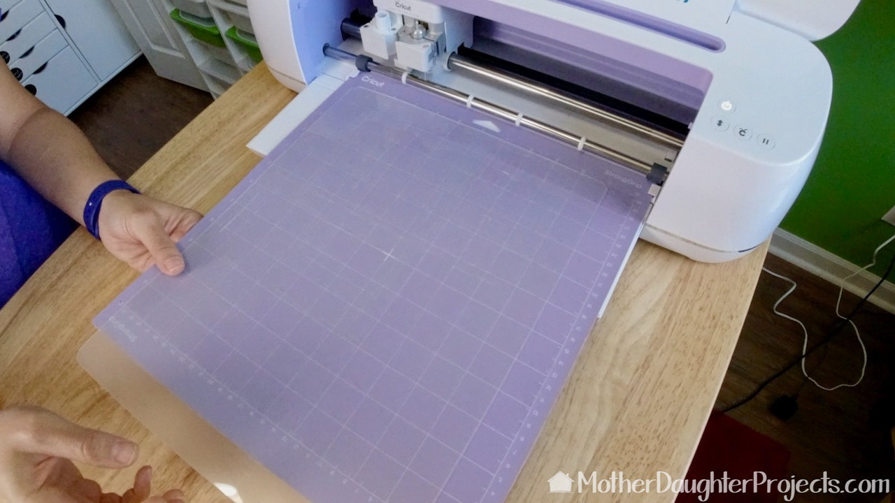 Use the purple Cricut sticky mat for the cutting the dollar store cutting mat.