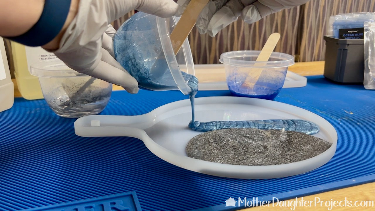 Adding a blue mica pigment to the TotalBoat silicone mold.