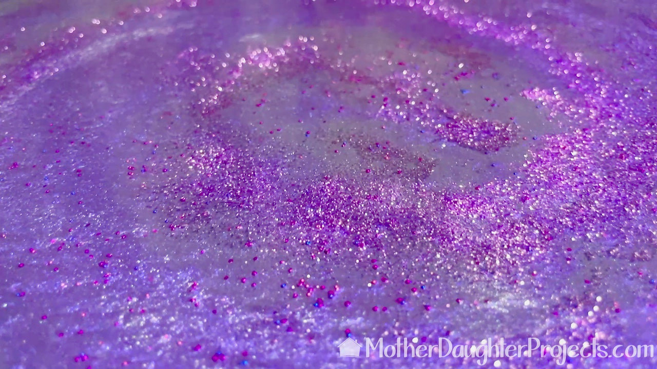 Close up of glittery epoxy galaxy table top.