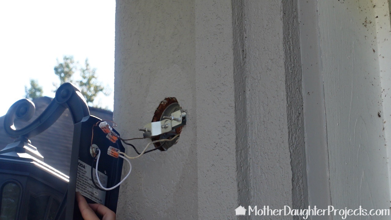Wiring up the second outdoor light fixture.
