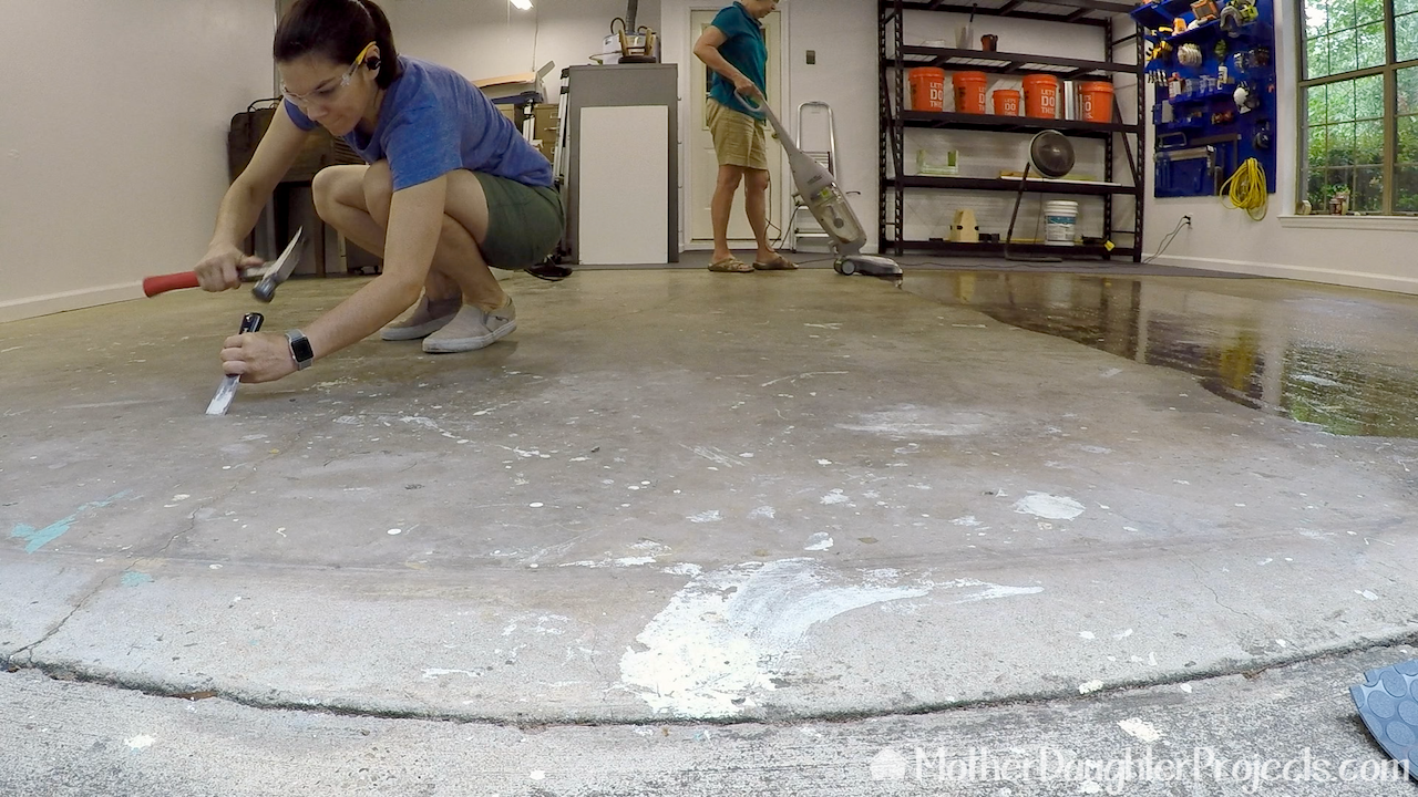 Cleaning the concrete floor.