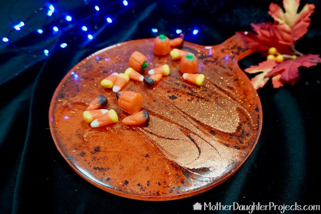 The finished three dimensional looking fall halloween totalboat epoxy charcuterie board.
