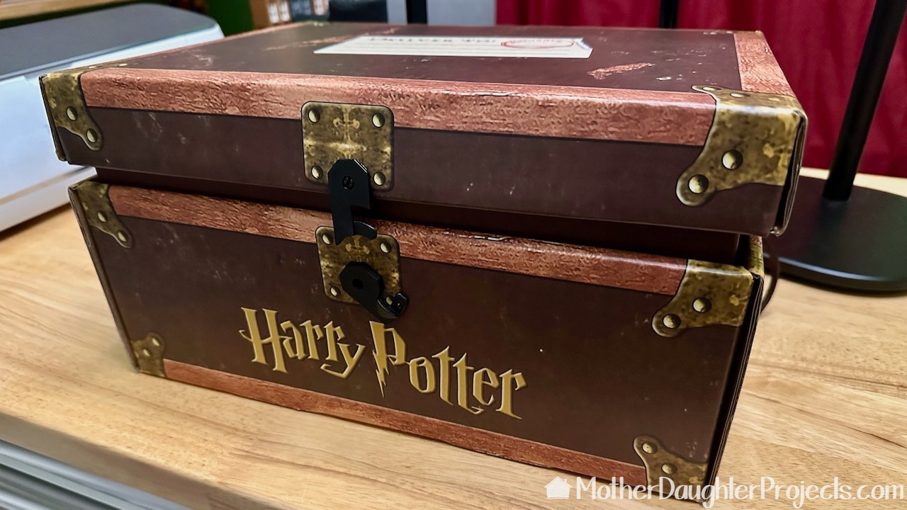 The cardboard trunk featuring all the Harry Potter books in the series. These are from Books a million. 