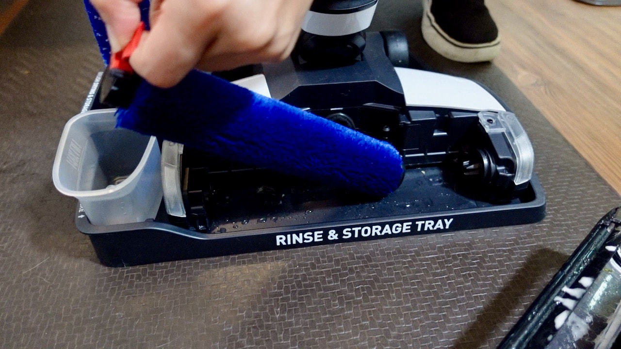 The rinse and storage tray is used to clean the onepwr brush on the cordless battery powered FloorMate