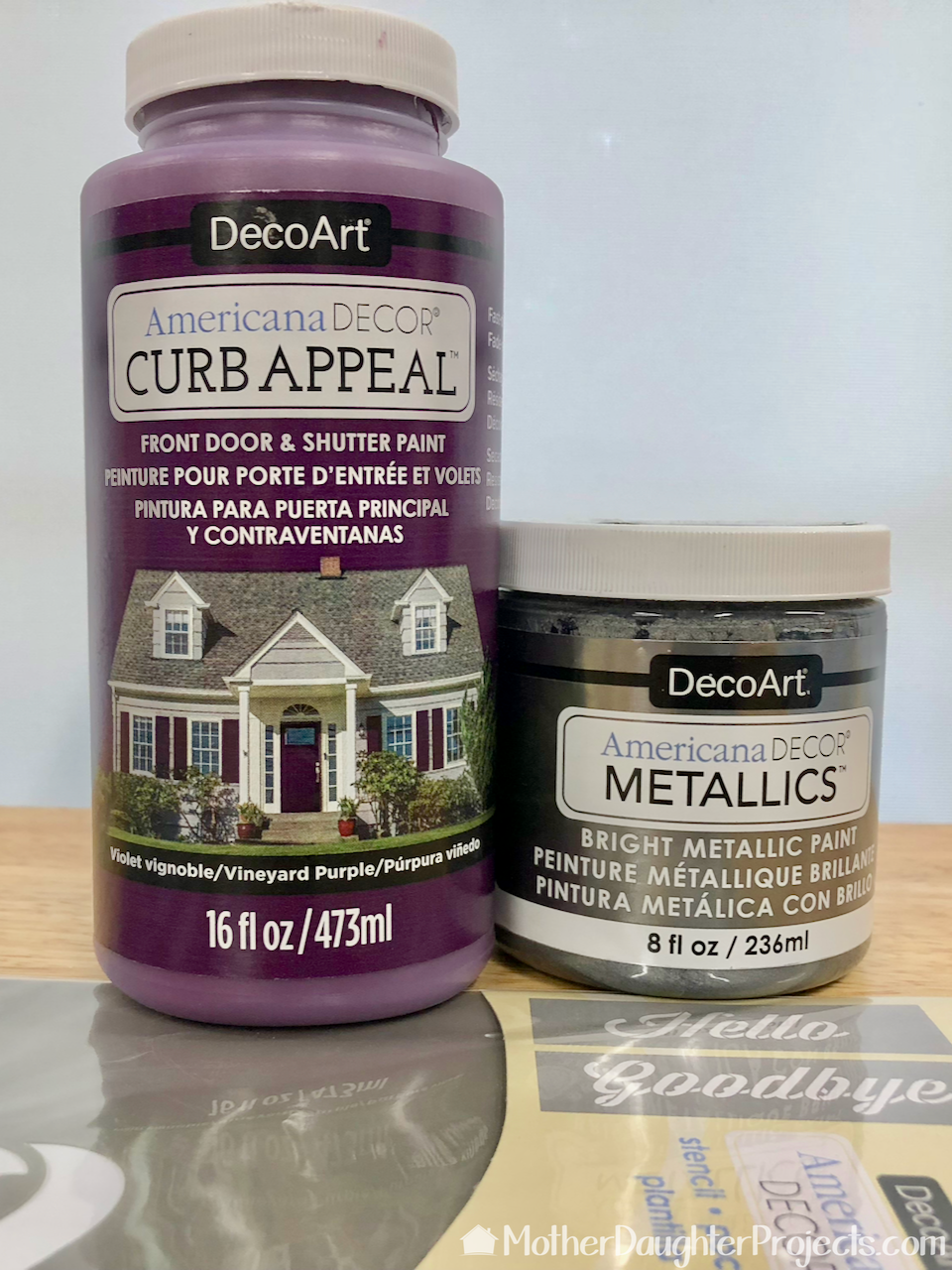 We used DecoArt Curb appeal paint and metallic paint we used. 