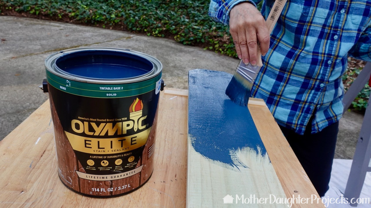 Staining with Olympic Elite Midnight Blue Solid Advanced Exterior Stain and Sealant.