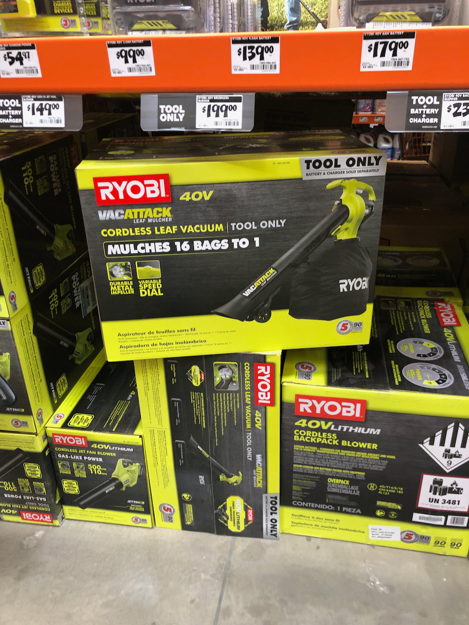 The Ryobi cordless leaf vacuum on the shelf at the Home Depot.
